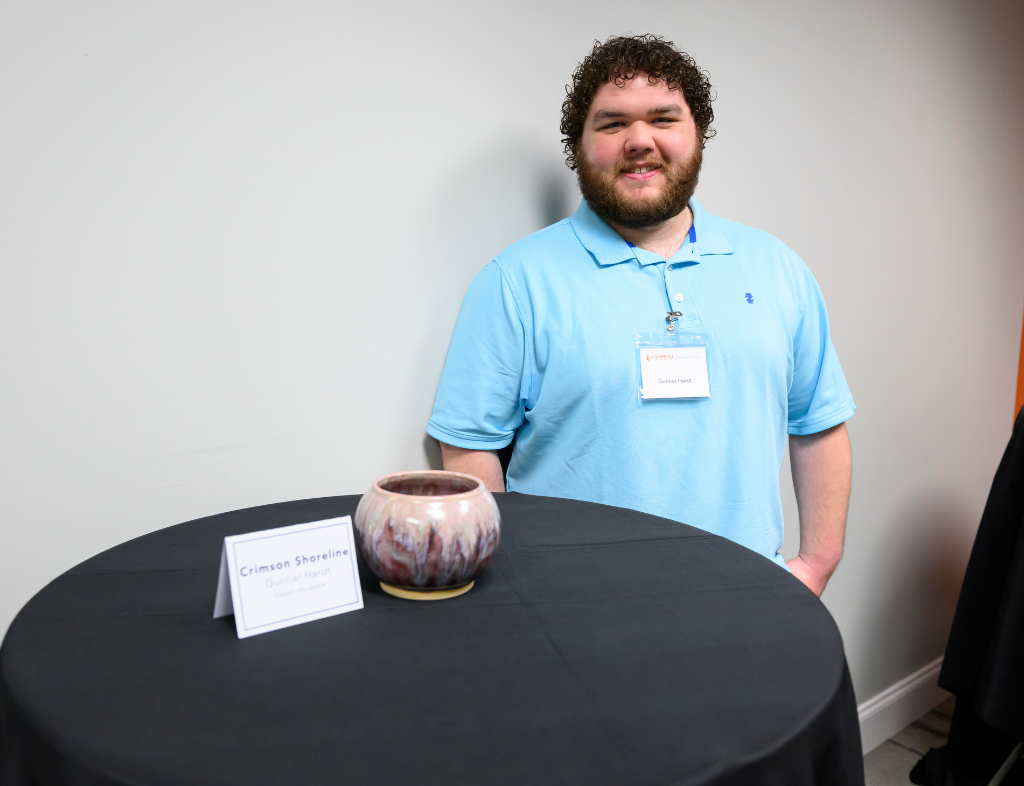 Gunnar Hardt poses with piece Crimson Shoreline